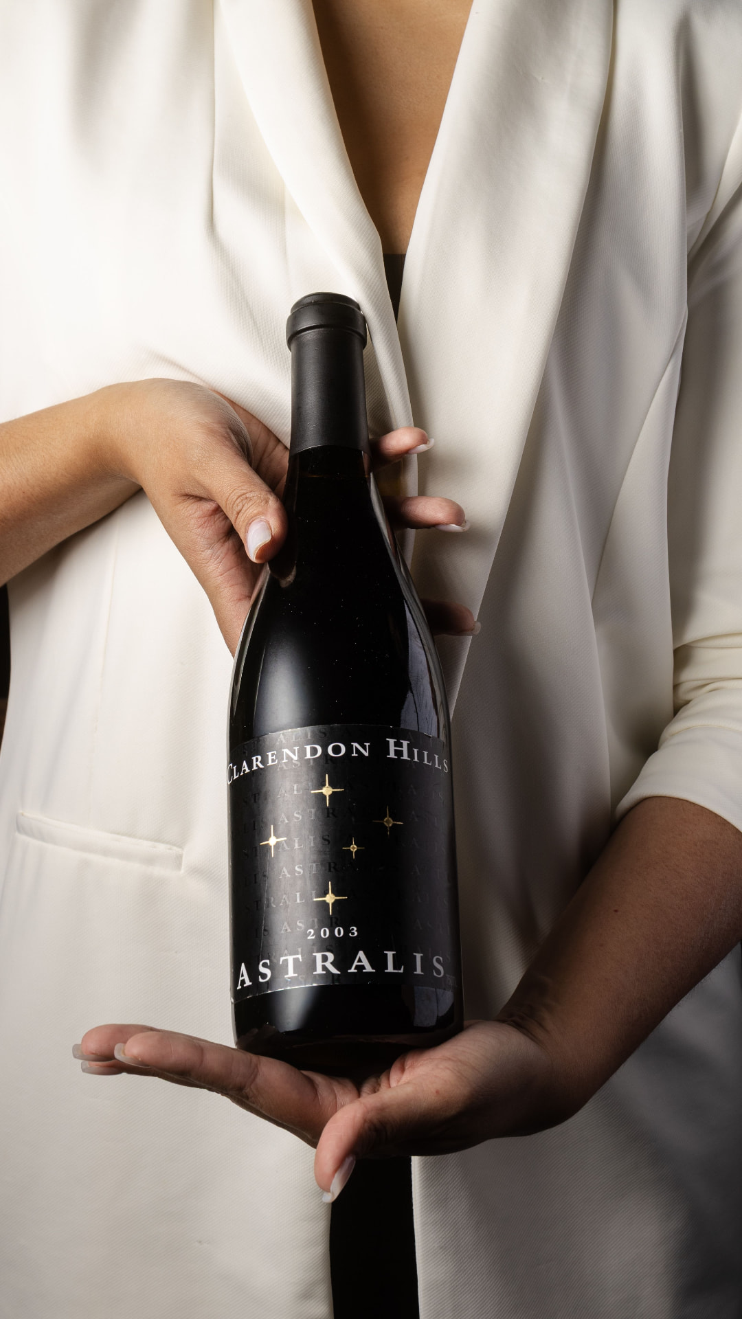 Sommelier presenting a red wine bottle