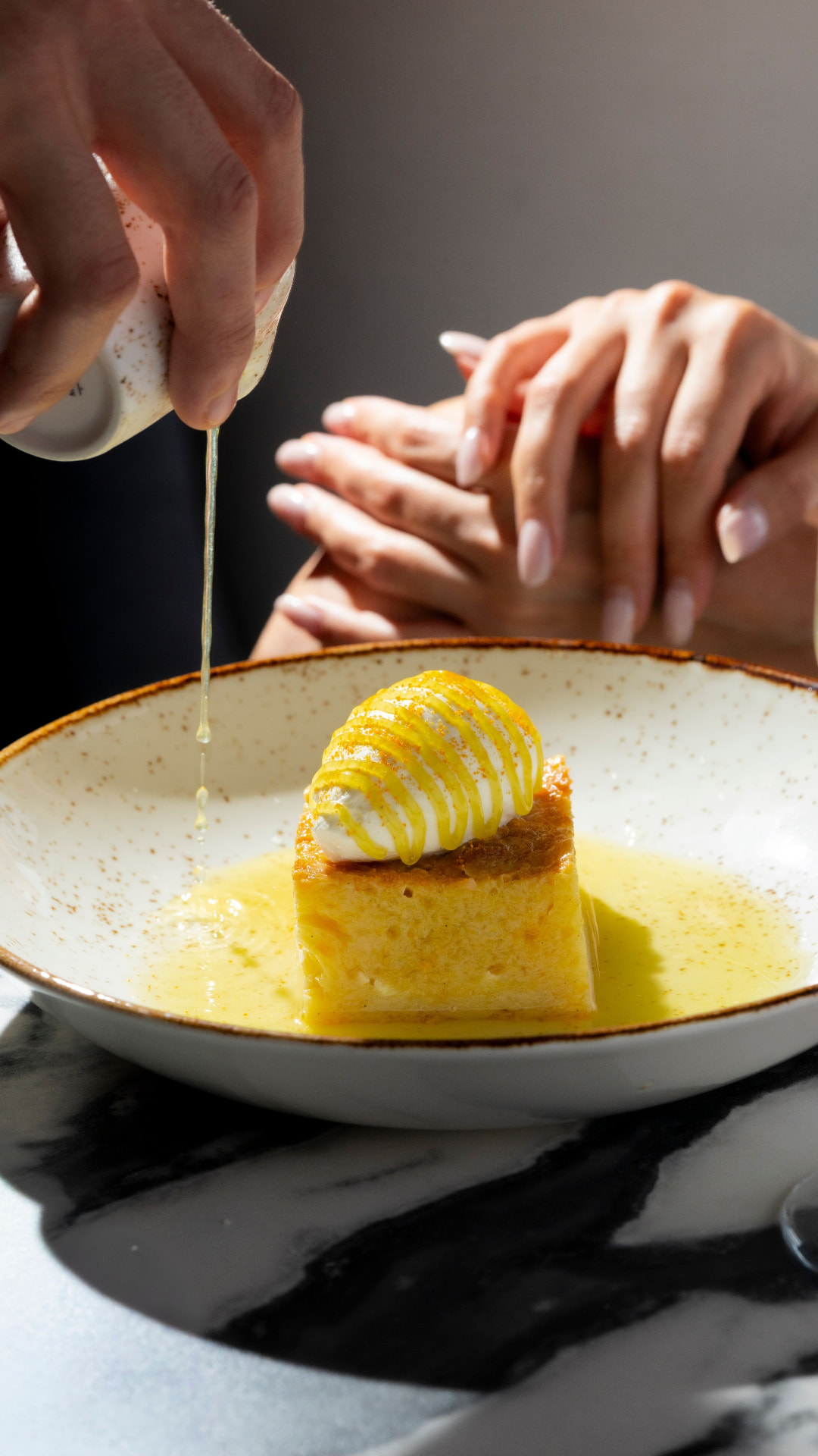 Honey drizzled over a custard dessert