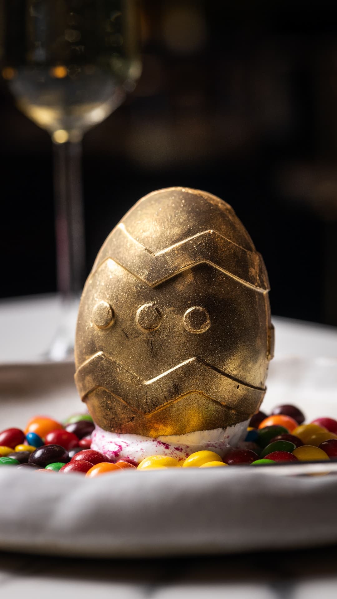 Gold chocolate egg dessert on candy