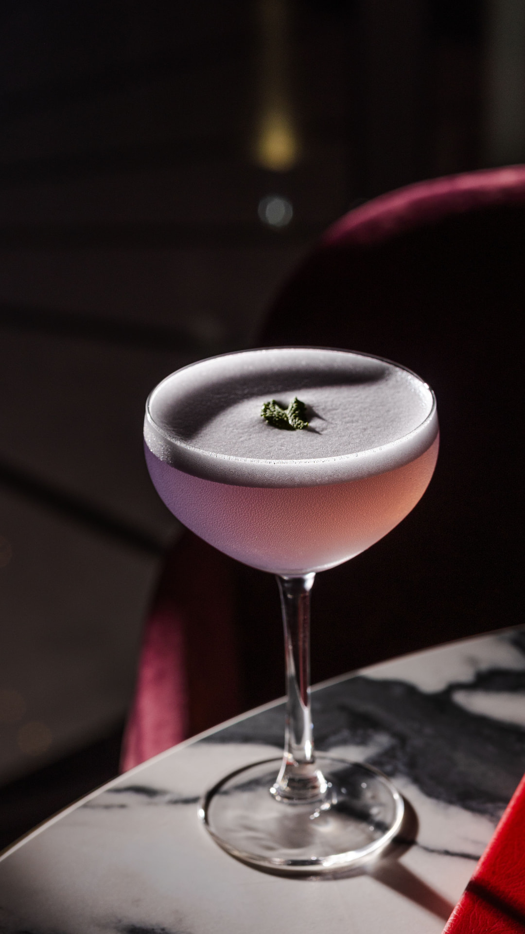 Coupe cocktail on marble table